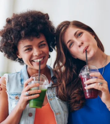 women drinking kratom smoothies